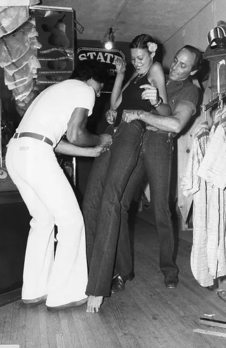 Framed Print : Men Helping a Woman Squeeze into Tight French Jeans Framed Print : Men Helping a Woman Squeeze into Tight French Jeans