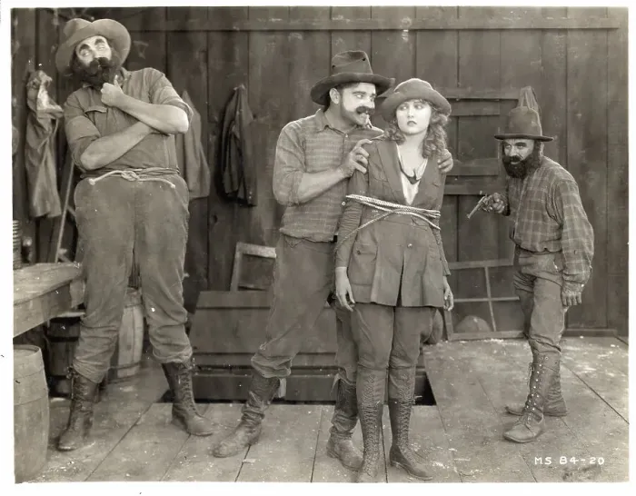 Framed Print : Men Hold Bound Woman Captive-Movie Still Framed Print : Men Hold Bound Woman Captive-Movie Still
