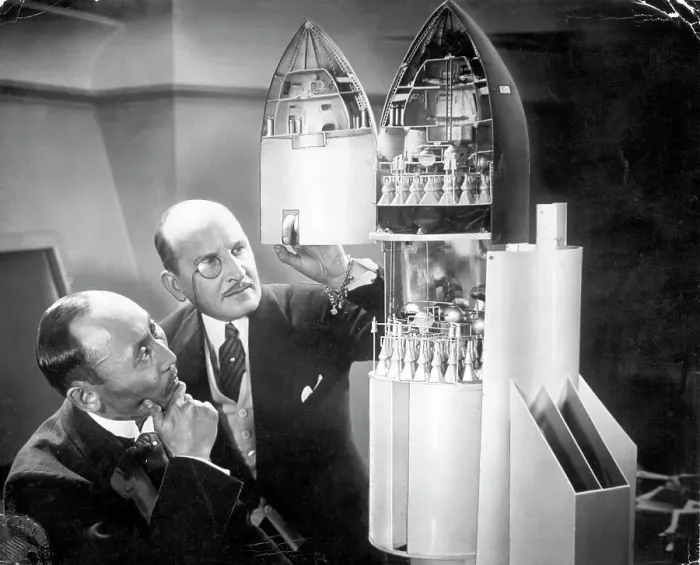 Framed Print : Men Inspecting Rocket Ship Model Framed Print : Men Inspecting Rocket Ship Model