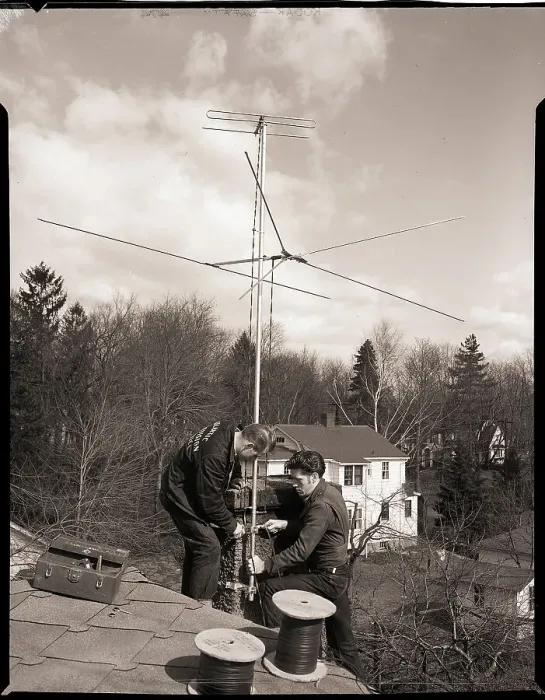 : Men Installing Rooftop Antenna : Men Installing Rooftop Antenna