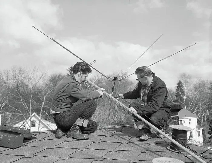 : Men Installing TV Antenna : Men Installing TV Antenna