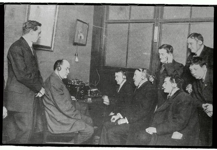 Framed Print : Men Listening to Radio with Earphones Framed Print : Men Listening to Radio with Earphones