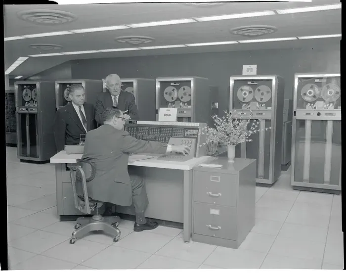 Framed Print : Men Looking Over Computer Printouts Framed Print : Men Looking Over Computer Printouts