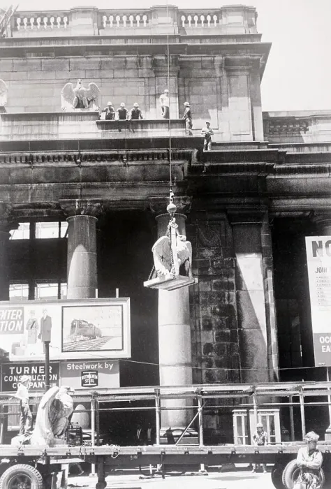 Framed Print : Men Lowering Statue from Building