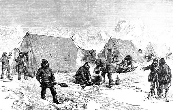 Men of a North Pole expedition cooking outside of the tents