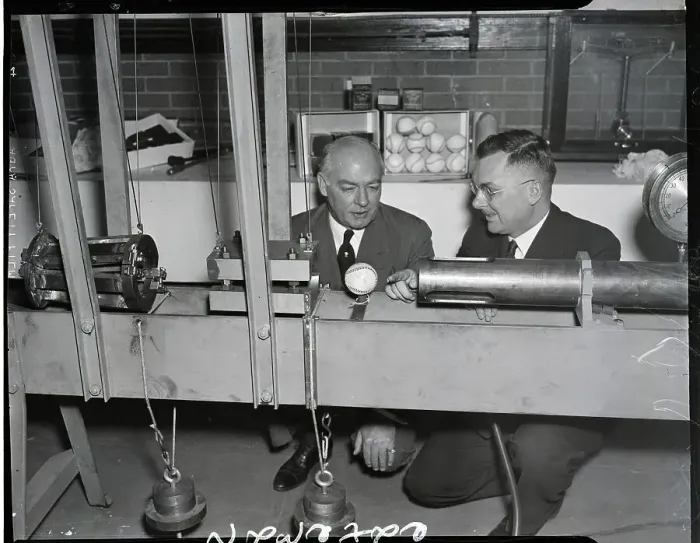 Framed Print : Men Observe Machine For Testing Baseball Framed Print : Men Observe Machine For Testing Baseball