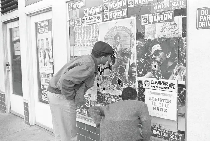 Framed Print : Men Observing Bullet Holes in Black Panther Headquarters Window Framed Print : Men Observing Bullet Holes in Black Panther Headquarters Window