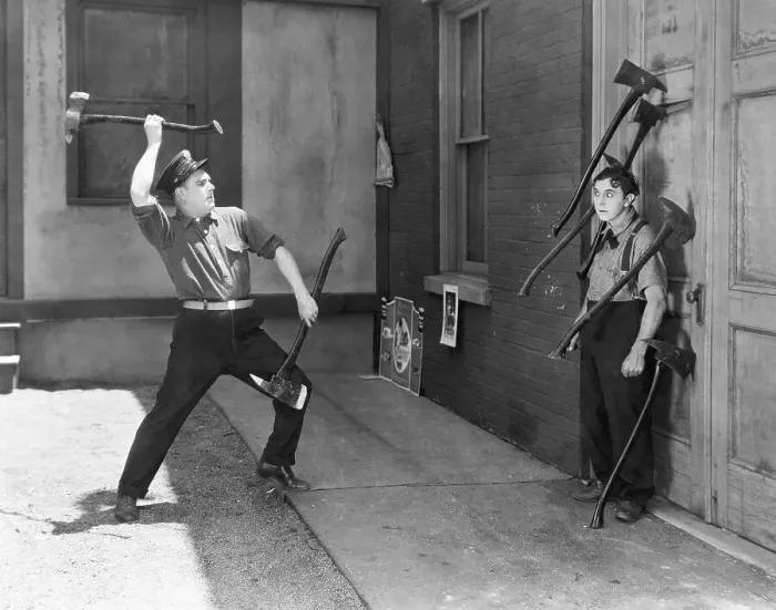 Framed Print : Men Performing Ax Throwing Stunt