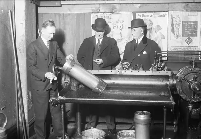 Framed Print : Men Place Mail in Pneumatic Tube Machine Framed Print : Men Place Mail in Pneumatic Tube Machine