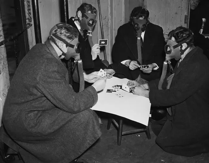 Framed Print : Four Men Play Cards With Gas Masks On Framed Print : Four Men Play Cards With Gas Masks On