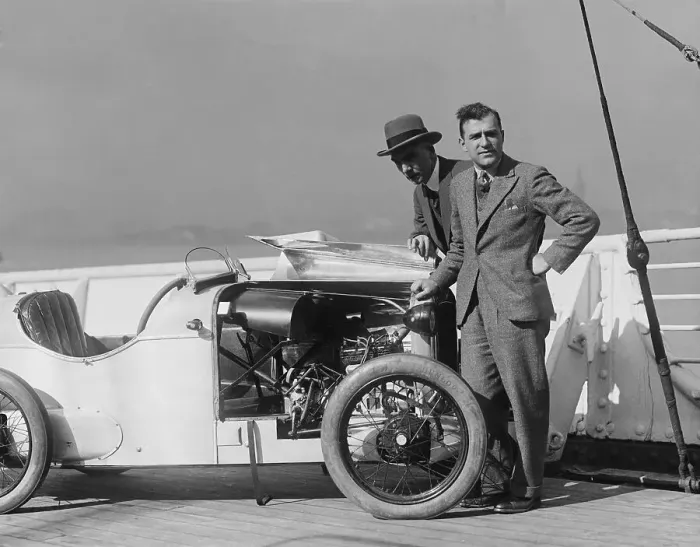 Framed Print : Men Posing with Small Sports Car Framed Print : Men Posing with Small Sports Car