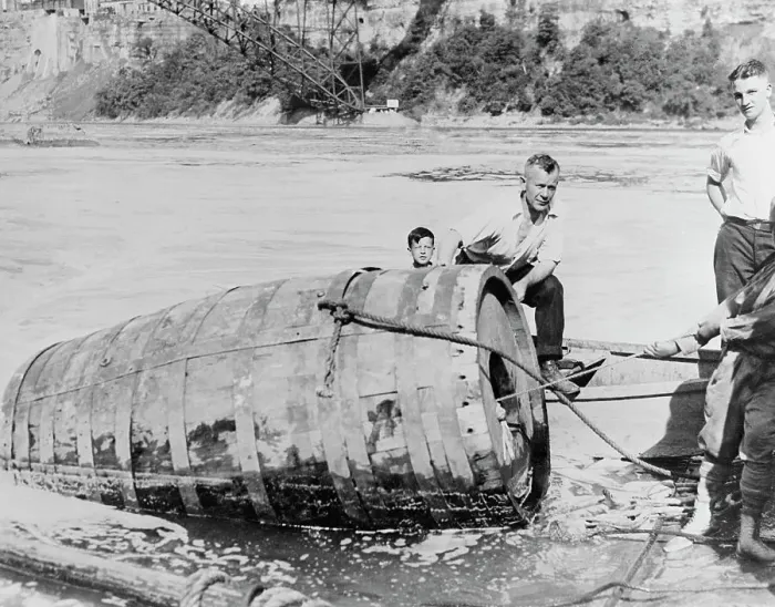 Framed Print : Men Pulling Large Death Barrel from Water Framed Print : Men Pulling Large Death Barrel from Water
