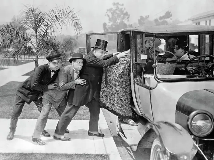 Framed Print : Men Pushing Stout Woman into Automobile Framed Print : Men Pushing Stout Woman into Automobile