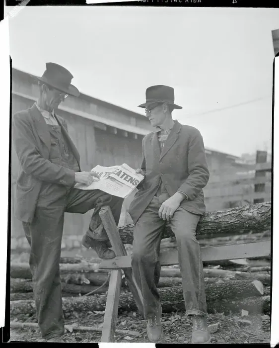 Framed Print : Two Men Reading a Newspaper Framed Print : Two Men Reading a Newspaper