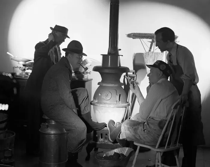 Framed Print : Men Seated In Front Of Potbellied Stove Framed Print : Men Seated In Front Of Potbellied Stove