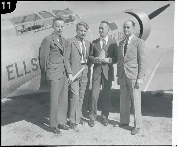 Framed Print : Men Standing in Front of Plane Framed Print : Men Standing in Front of Plane