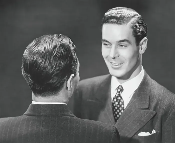 Framed Print : Two men in full suits talking in studio, (B&W), elevated view Framed Print : Two men in full suits talking in studio, (B&W), elevated view
