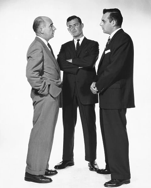 Three men talking