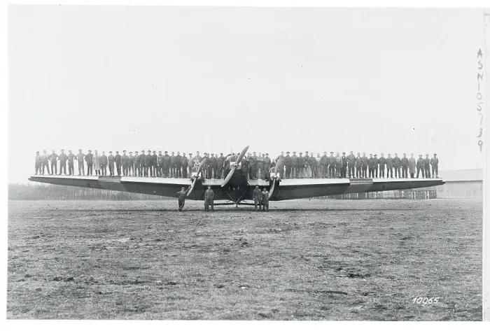 Framed Print : Men Testing a Plane's Wing Rigidity Framed Print : Men Testing a Plane's Wing Rigidity