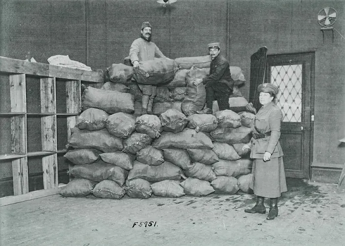 Framed Print : Men Unloading Bags of Socks