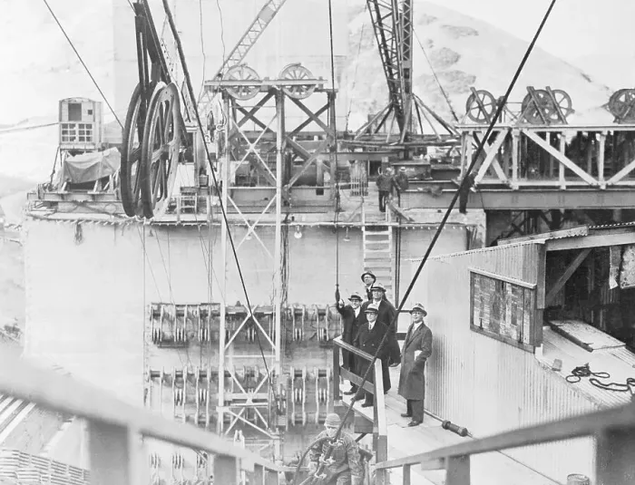 Framed Print : Men Watching Spinning Cable Operation Framed Print : Men Watching Spinning Cable Operation