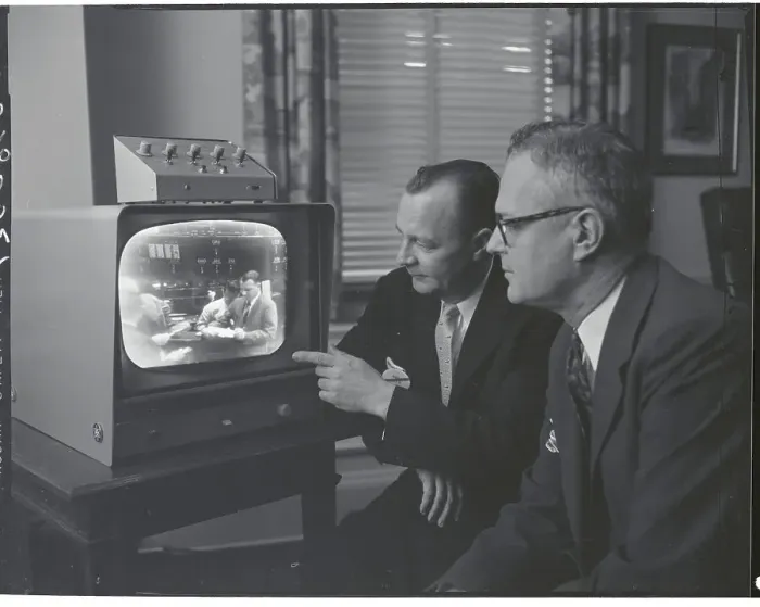 : Men Watching TV Broadcast : Men Watching TV Broadcast