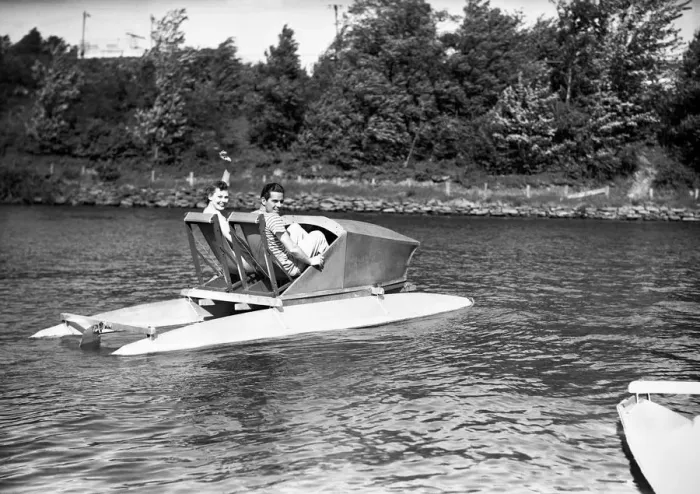 Framed Print : Two men in water pedalo, (B&W) Framed Print : Two men in water pedalo, (B&W)