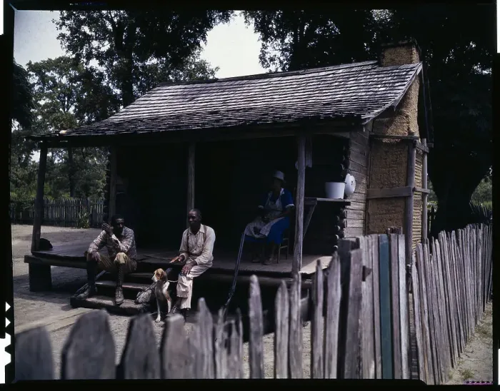 Framed Print : Two Men and Woman Sitting on Shack Porch Framed Print : Two Men and Woman Sitting on Shack Porch