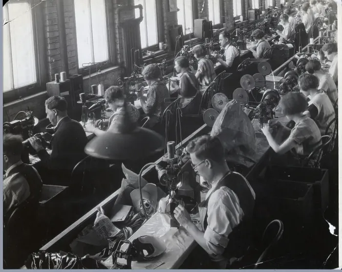 Framed Print : Men and Women Sewing in Textile Factory Framed Print : Men and Women Sewing in Textile Factory