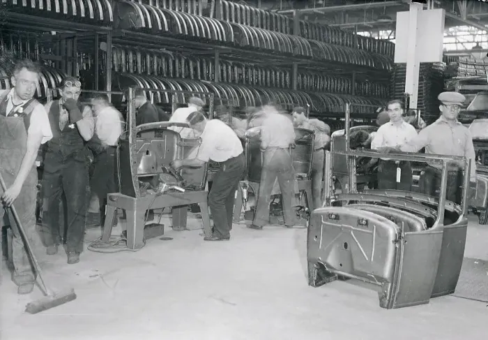 Framed Print : Men Working on an Assembly Line Framed Print : Men Working on an Assembly Line