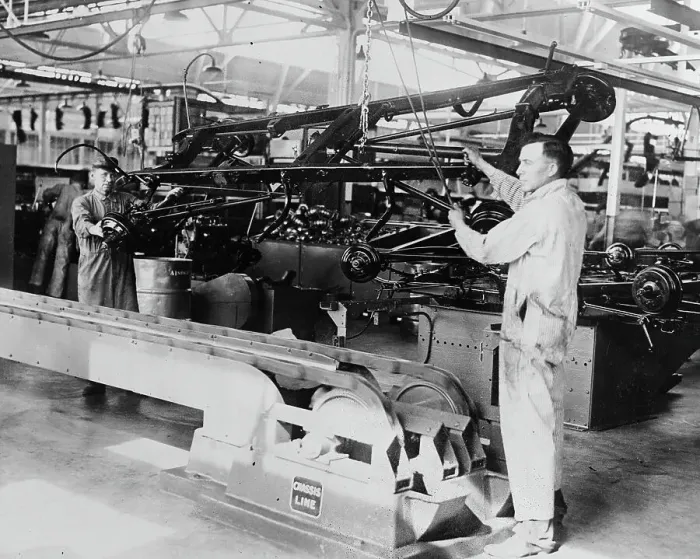 Framed Print : Men Working on an Assembly Line Framed Print : Men Working on an Assembly Line