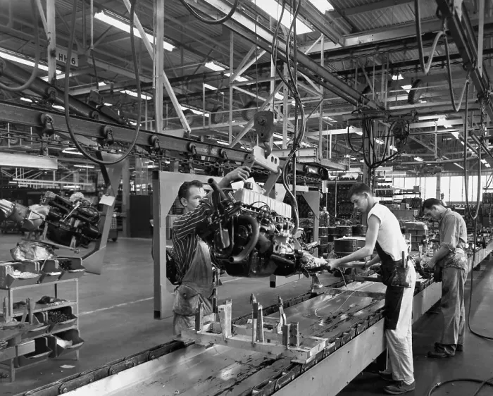 Framed Print : Men Working on Engine in Assembly Plant Framed Print : Men Working on Engine in Assembly Plant