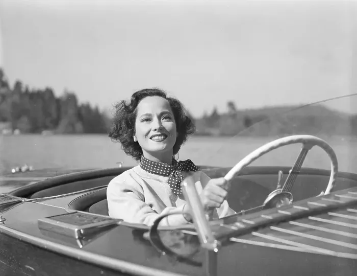 Framed Print : Merle Oberon Driving a Motorboat