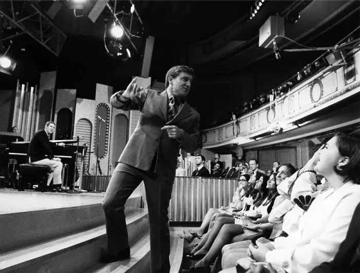 Framed Print : Merv Griffin Fluffs His Audience Before The Show Framed Print : Merv Griffin Fluffs His Audience Before The Show