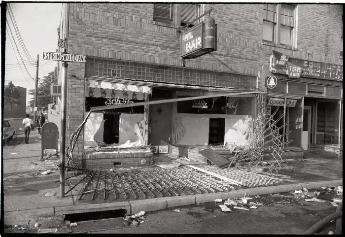 Framed Print : Metal Grill Torn Down in Front of Bar Framed Print : Metal Grill Torn Down in Front of Bar