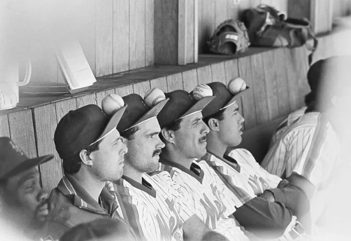 Framed Print : Mets Players Sitting with Baseballs on Their Caps Framed Print : Mets Players Sitting with Baseballs on Their Caps