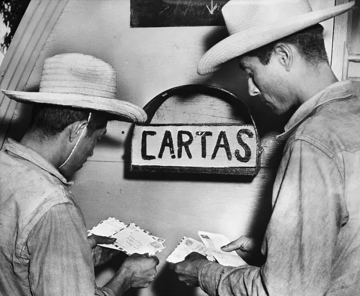 Framed Print : Mexican Migrant Workers Receive Letters Framed Print : Mexican Migrant Workers Receive Letters