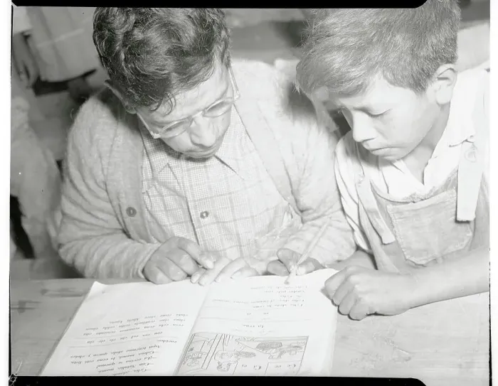 Framed Print : Mexican Parent and Son Reading from Book Framed Print : Mexican Parent and Son Reading from Book