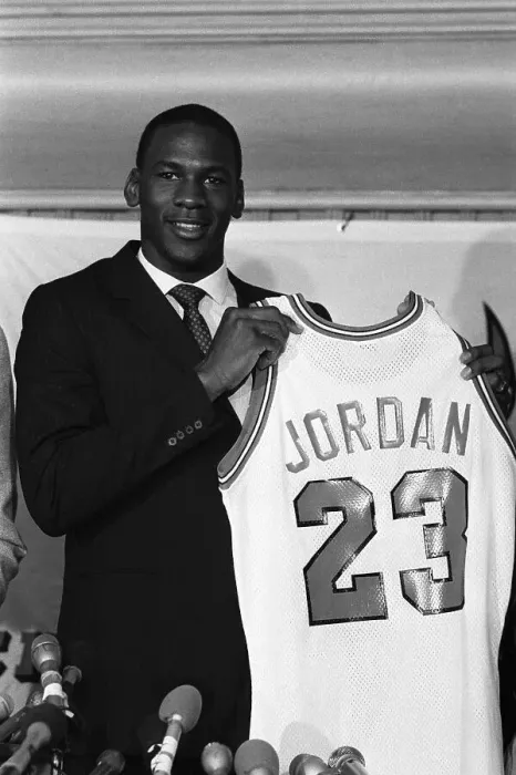 Framed Print : Michael Jordan Displaying His Team Jersey Framed Print : Michael Jordan Displaying His Team Jersey