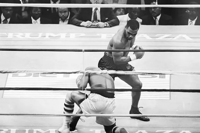 Framed Print : Michael Spinks Kneels As M.Tyson Punches Framed Print : Michael Spinks Kneels As M.Tyson Punches