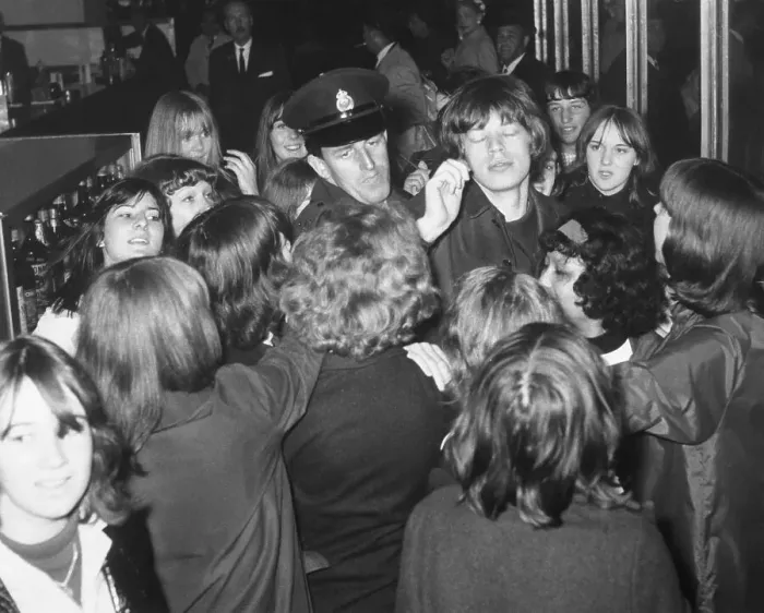Framed Print : Mick Jagger Surrounded by Fans and Police Framed Print : Mick Jagger Surrounded by Fans and Police