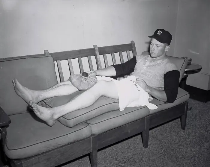 Framed Print : Mickey Mantle Lying on Couch with Covering on Injured Knee Framed Print : Mickey Mantle Lying on Couch with Covering on Injured Knee