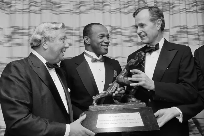 Framed Print : Mike Rozier Showing Heisman Trophy to George Bush Framed Print : Mike Rozier Showing Heisman Trophy to George Bush