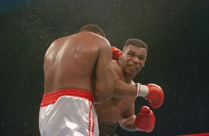 Framed Print : Mike Tyson Punching Larry Holmes Framed Print : Mike Tyson Punching Larry Holmes