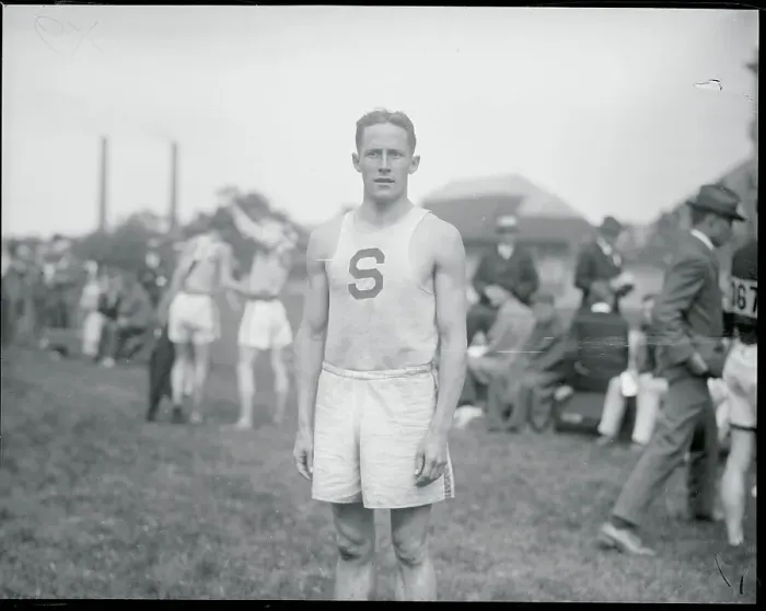 Framed Print : One Mile Run Winner at Track and Field Meet Framed Print : One Mile Run Winner at Track and Field Meet