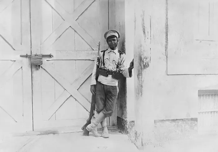 Framed Print : Military Guard Leaning Against Door Frame Framed Print : Military Guard Leaning Against Door Frame