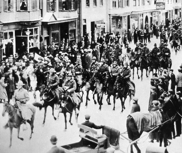 Military on Horses. A Photograph of Military on Horseback with People Watching
