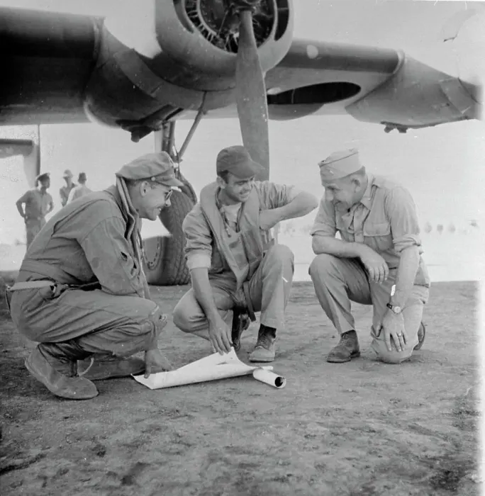 Framed Print : Military Men Going over Bombing Mission Near Aircraft