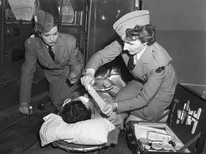 Framed Print : Military Nurses Treating Wounded Soldier Framed Print : Military Nurses Treating Wounded Soldier