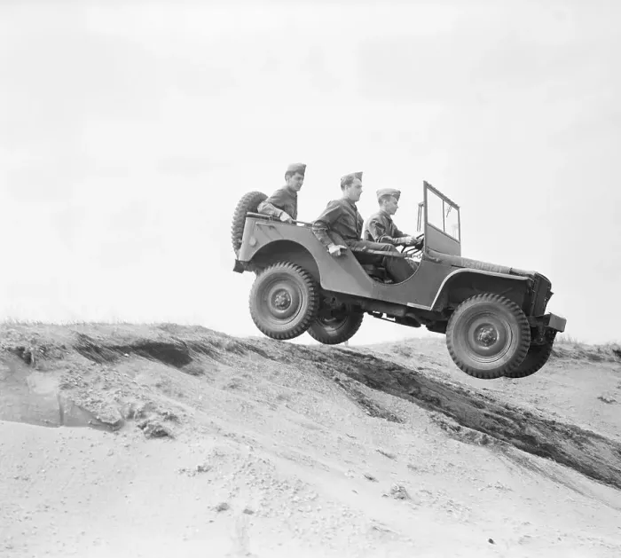 Framed Print : Military Personnel Driving Jeep down Dunes Framed Print : Military Personnel Driving Jeep down Dunes